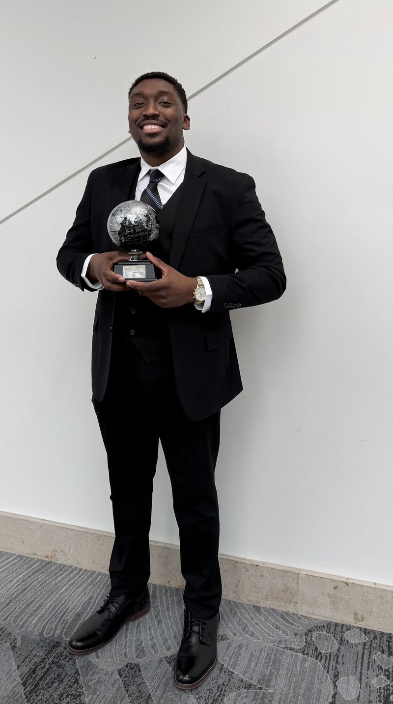 Absalute Management leadership holding a company recognition award